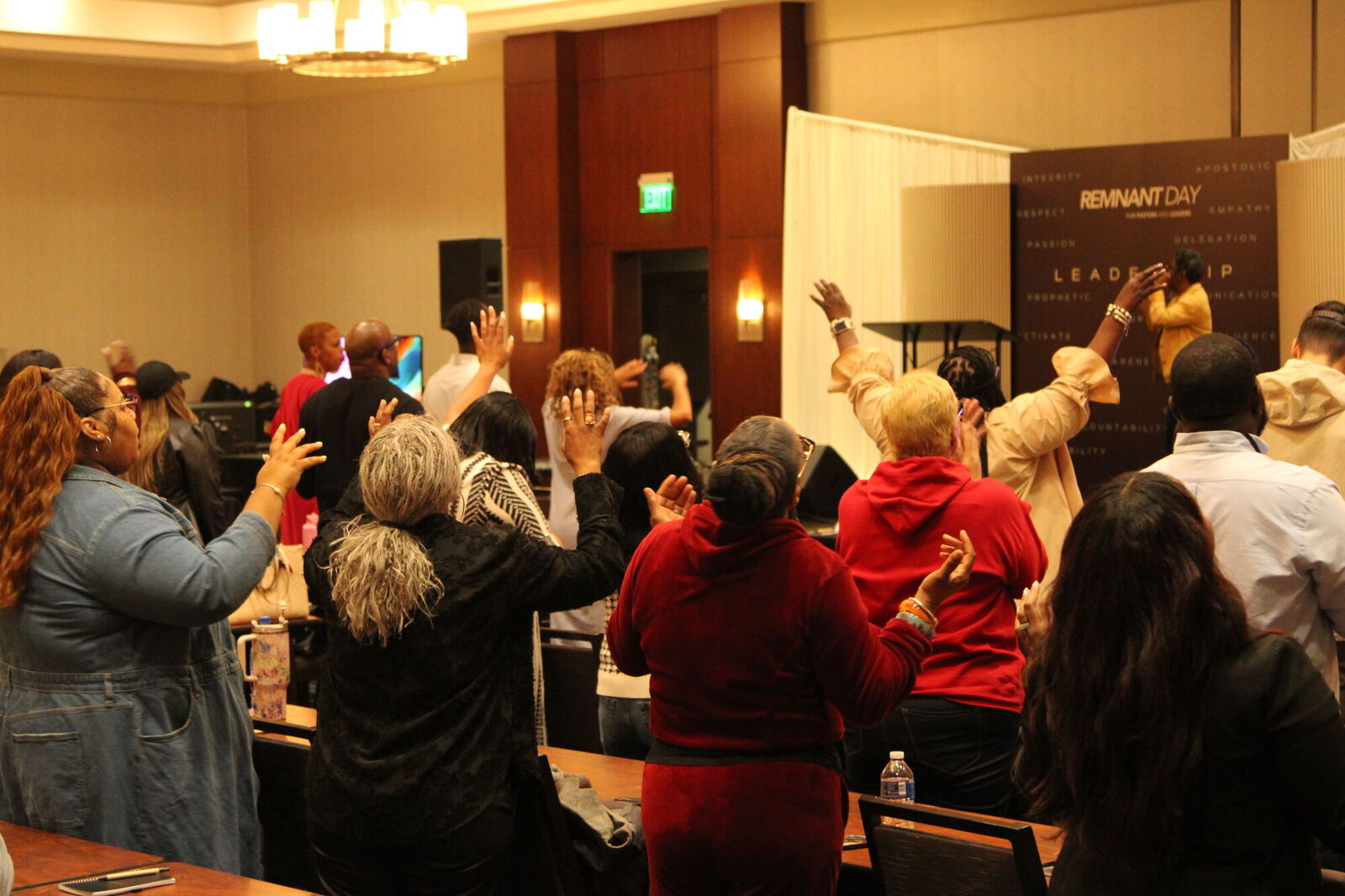 Leaders on their feet in worship at Remnant Day